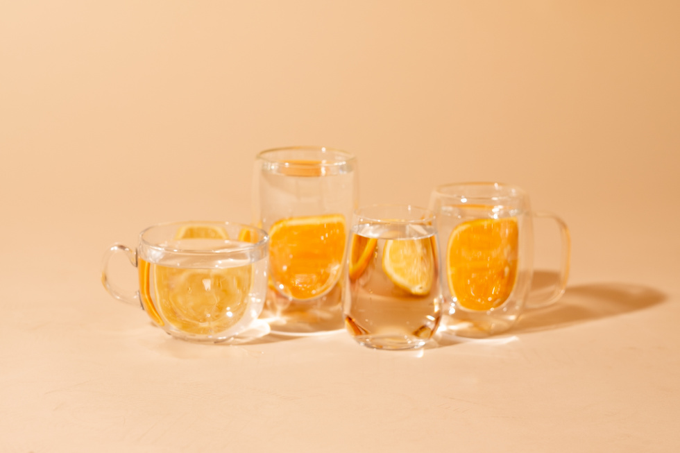 Mugs with Water and Orange Slices